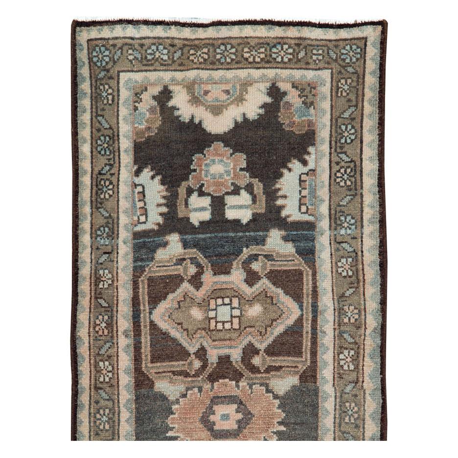 An antique Persian Malayer rug in runner format handmade during the early 20th century.

Measures: 1' 9