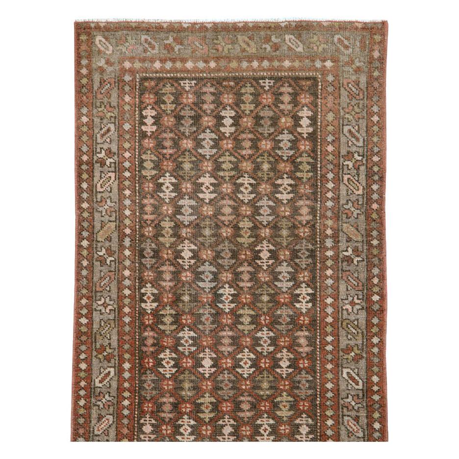 An antique Persian Malayer rug in runner format handmade during the early 20th century.

Measures: 2' 0