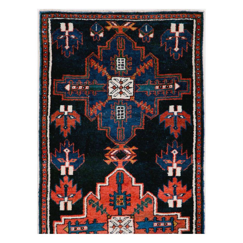 An antique Persian Malayer rug in runner format handmade during the early 20th century.

Measures: 2' 4