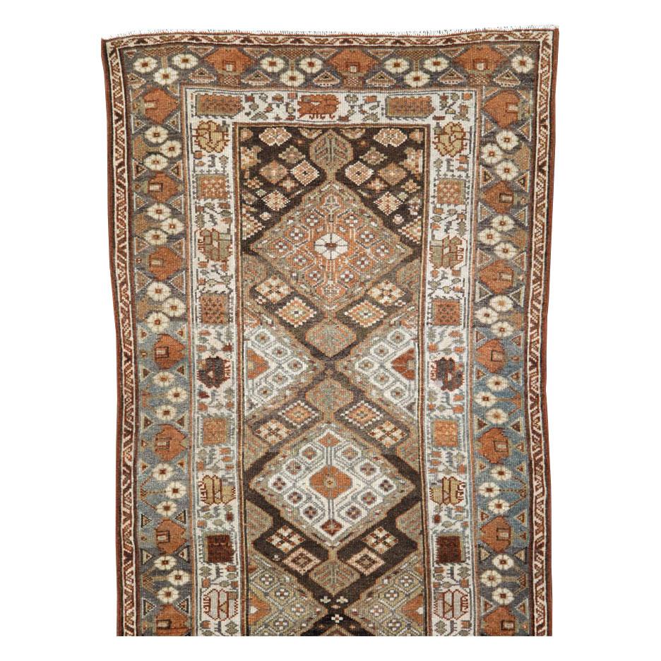 An antique Persian Malayer rug in runner format handmade during the early 20th century.

Measures: 2' 11