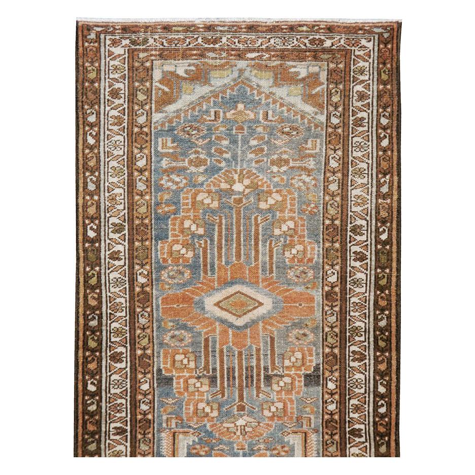 An antique Persian Malayer rug in runner format handmade during the early 20th century.

Measures: 2' 9