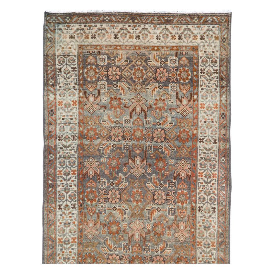 An antique Persian Malayer rug in runner format handmade during the early 20th century.

Measures: 2' 10