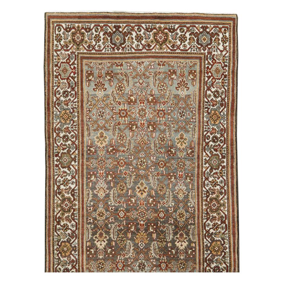 An antique Persian Malayer rug in runner format handmade during the early 20th century.

Measures: 3' 5