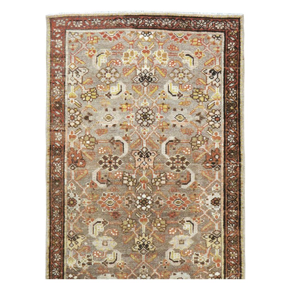 An antique Persian Malayer runner handmade during the early 20th century.