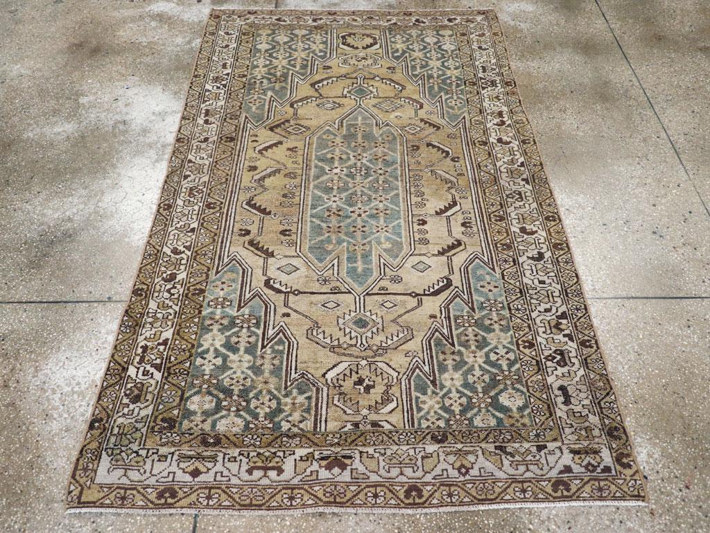 An antique Persian Malayer small accent rug handmade during the early 20th century.

Measures: 4' 2