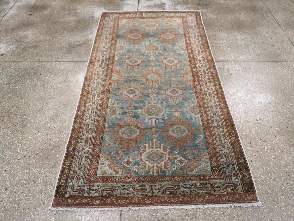 An antique Persian Malayer small accent rug handmade during the early 20th century.

Measures: 3' 6