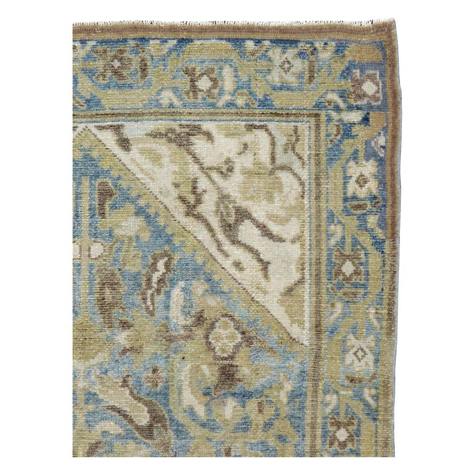 An antique Persian Malayer throw rug handmade during the early 20th century.

Measures: 3' 7