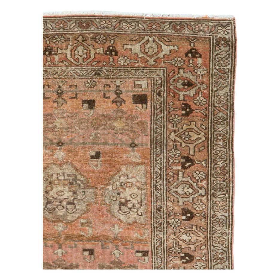 An antique Persian Malayer throw rug handmade during the early 20th century.

Measures: 3' 6