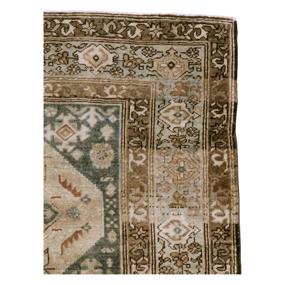 An antique Persian Malayer throw rug handmade during the early 20th century.

Measures: 3' 9