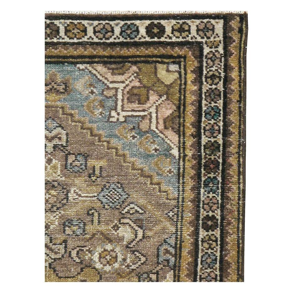 An antique Persian Malayer throw rug handmade during the early 20th century.

Measures: 2' 4