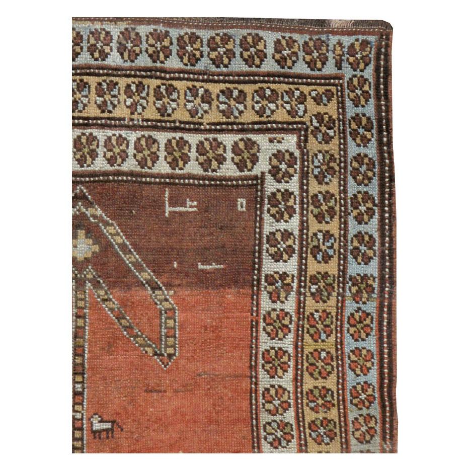 An antique Persian Malayer throw rug handmade during the early 20th century.

Measures: 3' 3