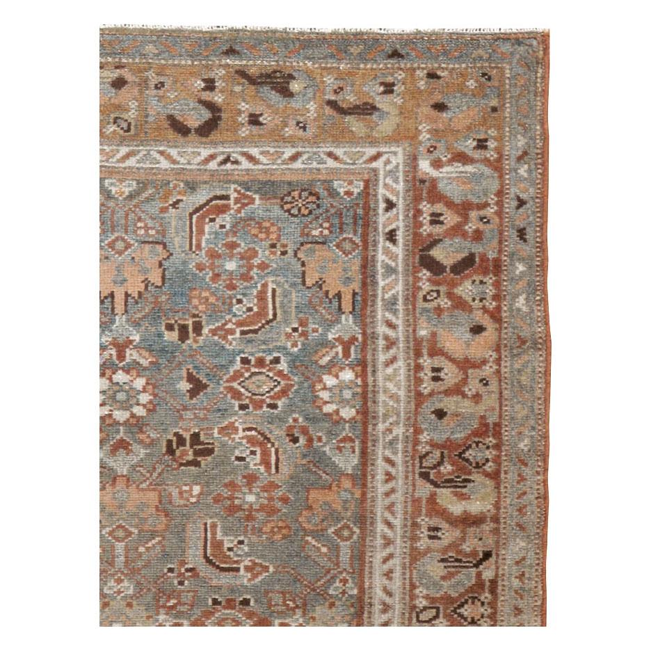 An antique Persian Malayer throw rug handmade during the early 20th century.

Measures: 3' 3