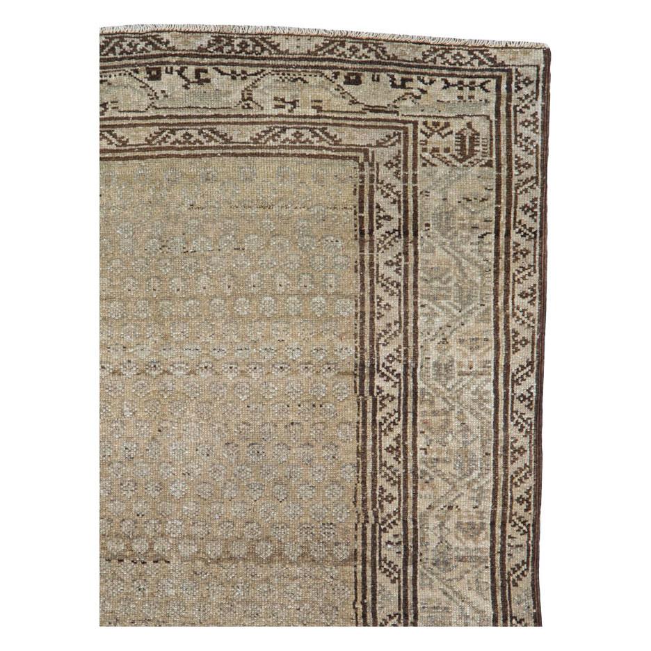 An antique Persian Malayer throw rug handmade during the early 20th century.

Measures: 3' 4