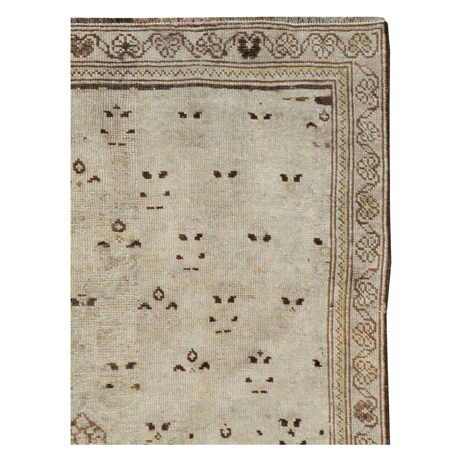 An antique Persian Malayer throw rug handmade during the early 20th century.

Measures: 2' 8