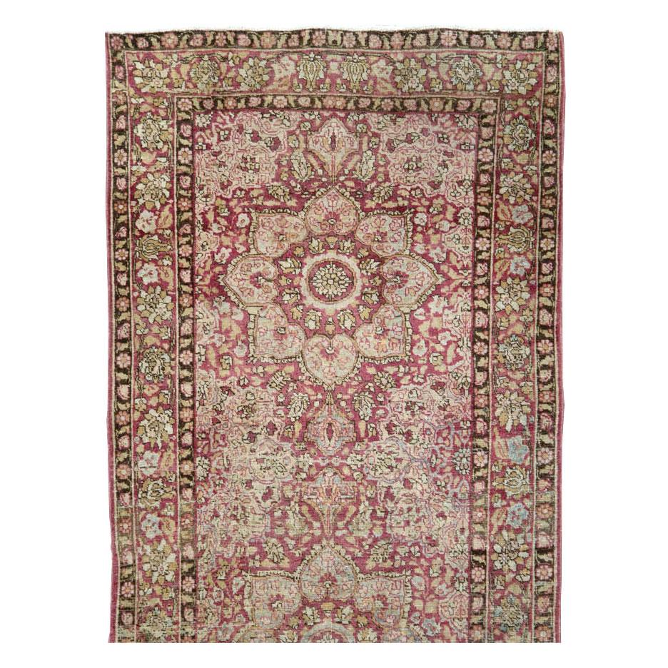 An antique Persian Mashad long runner handmade during the early 20th century.

Measures: 3' 1