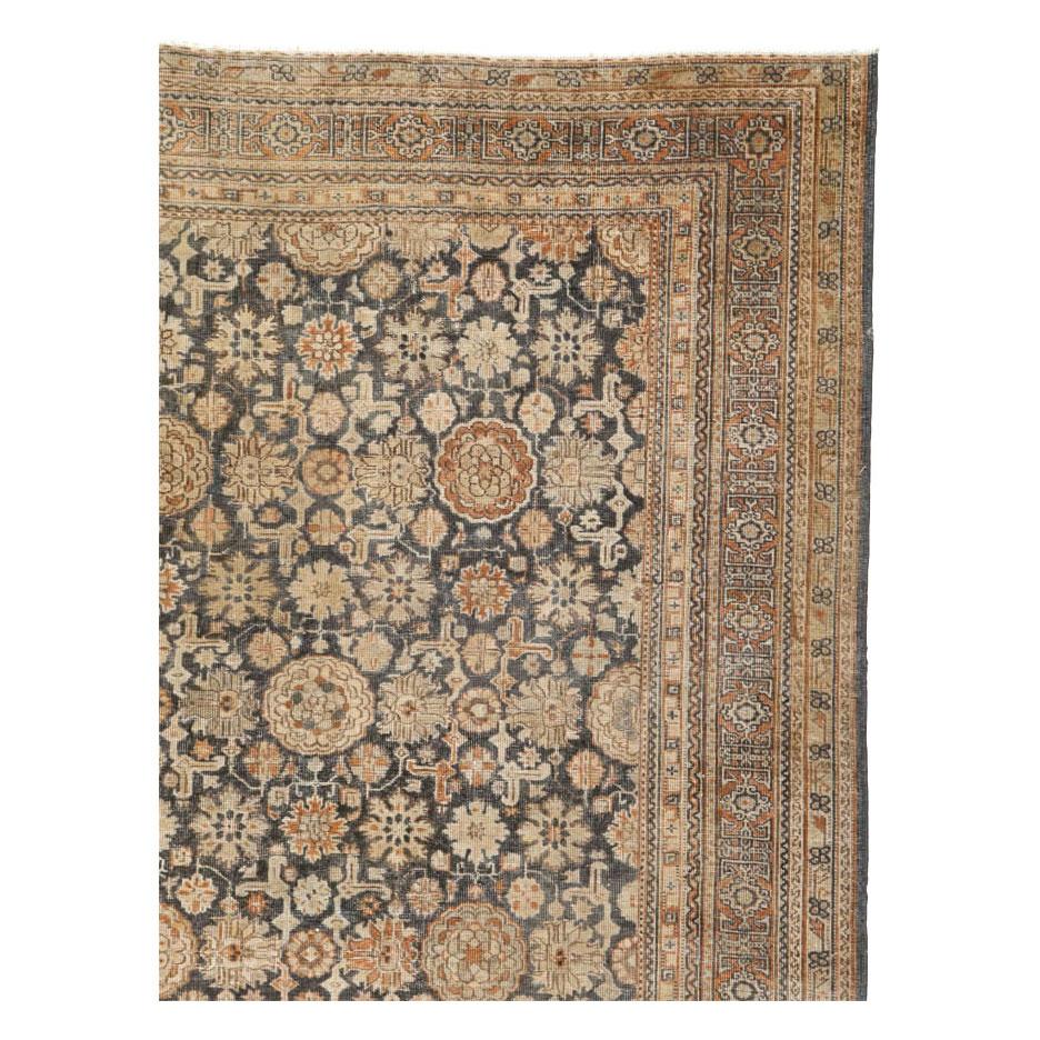 Rustic Early 20th Century Handmade Persian Room Size Carpet In Charcoal and Rust