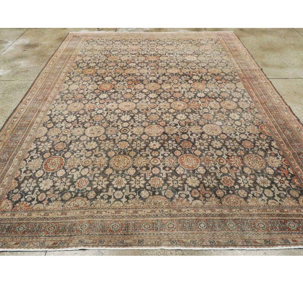 Hand-Knotted Early 20th Century Handmade Persian Room Size Carpet In Charcoal and Rust