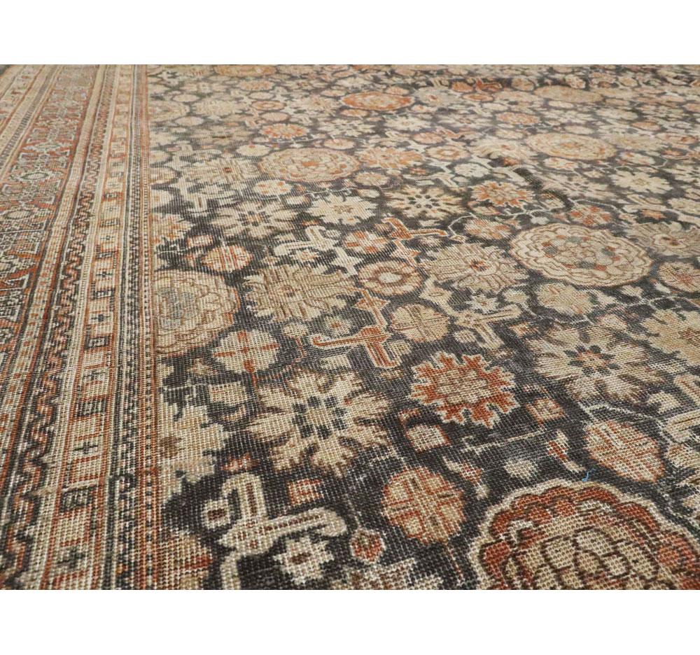 Early 20th Century Handmade Persian Room Size Carpet In Charcoal and Rust In Good Condition In New York, NY