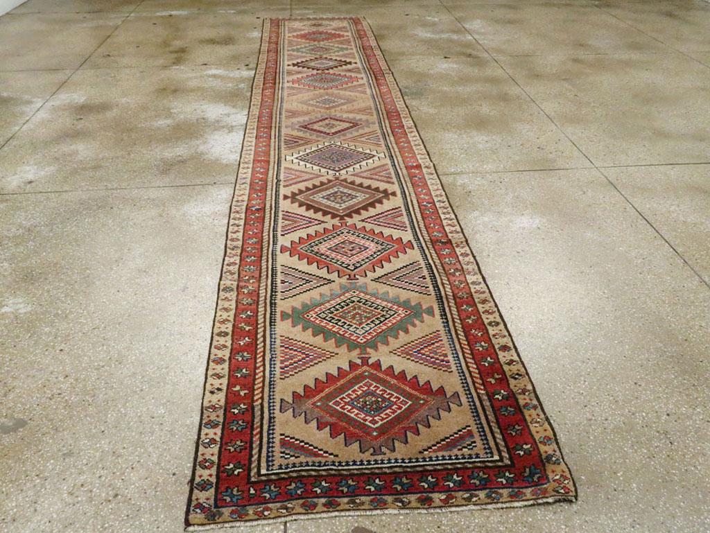 Hand-Knotted Early 20th Century Handmade Persian Runner with Brown, Green, and Rust Tones For Sale