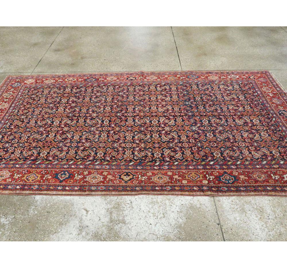 Laine Tapis d'appoint persan rustique rouge et bleu du début du XXe siècle, fait à la main en vente