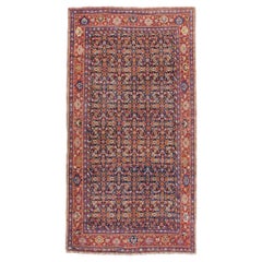 Tapis d'appoint persan rustique rouge et bleu du début du XXe siècle, fait à la main