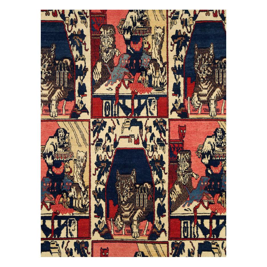 An antique Persian Senneh accent rug handmade during the early 20th century with 9 panels decorated by 2 individual design of cats.

Measures: 4' 6