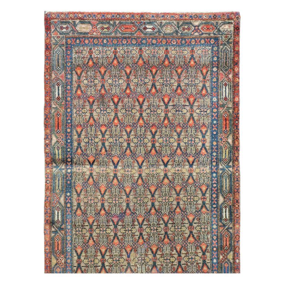 An antique Persian Serab rug in runner format handmade during the early 20th century.

Measures: 3' 5