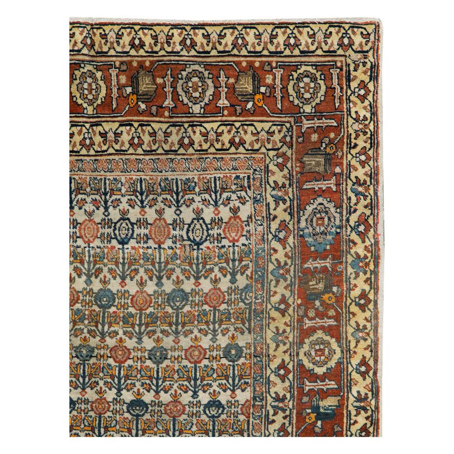 An antique Persian Tabriz accent rug handmade during the early 20th century.

Measures: 4' 0