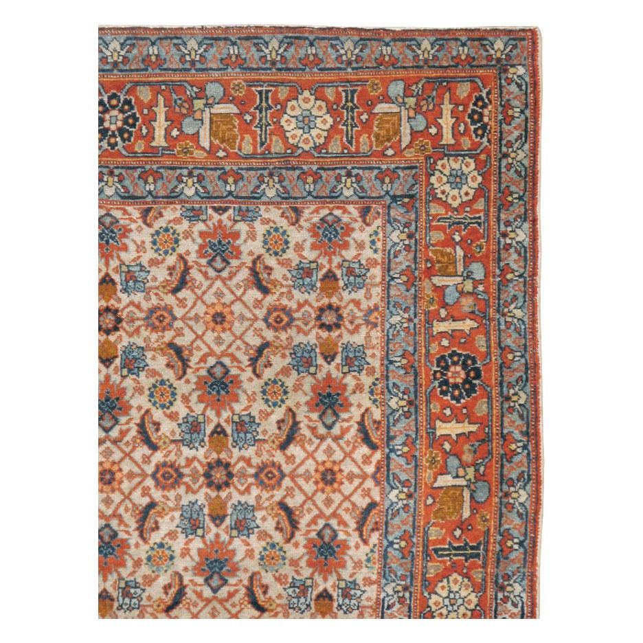 An antique Persian Tabriz accent rug handmade during the early 20th century.

Measures: 4' 1