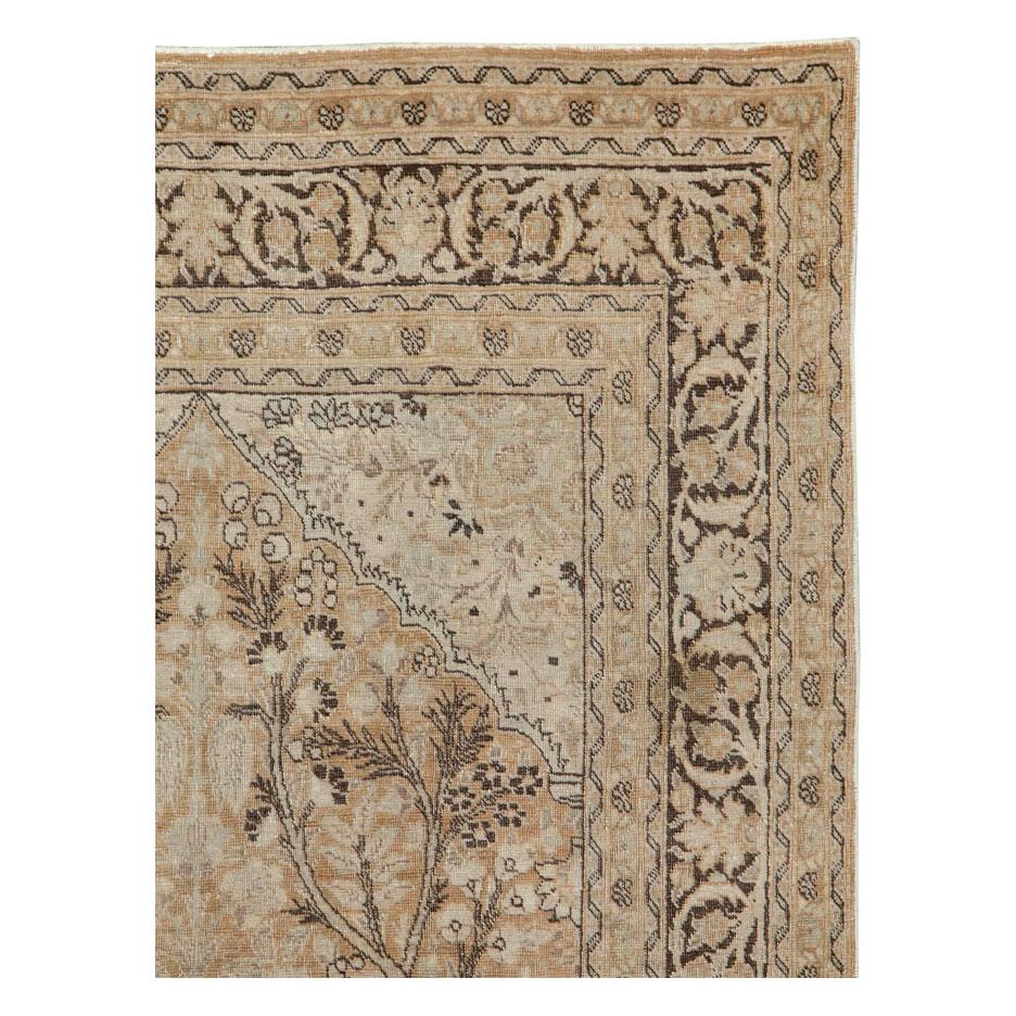 A vintage Persian Tabriz accent rug handmade during the early 20th century.

Measures: 4' 0
