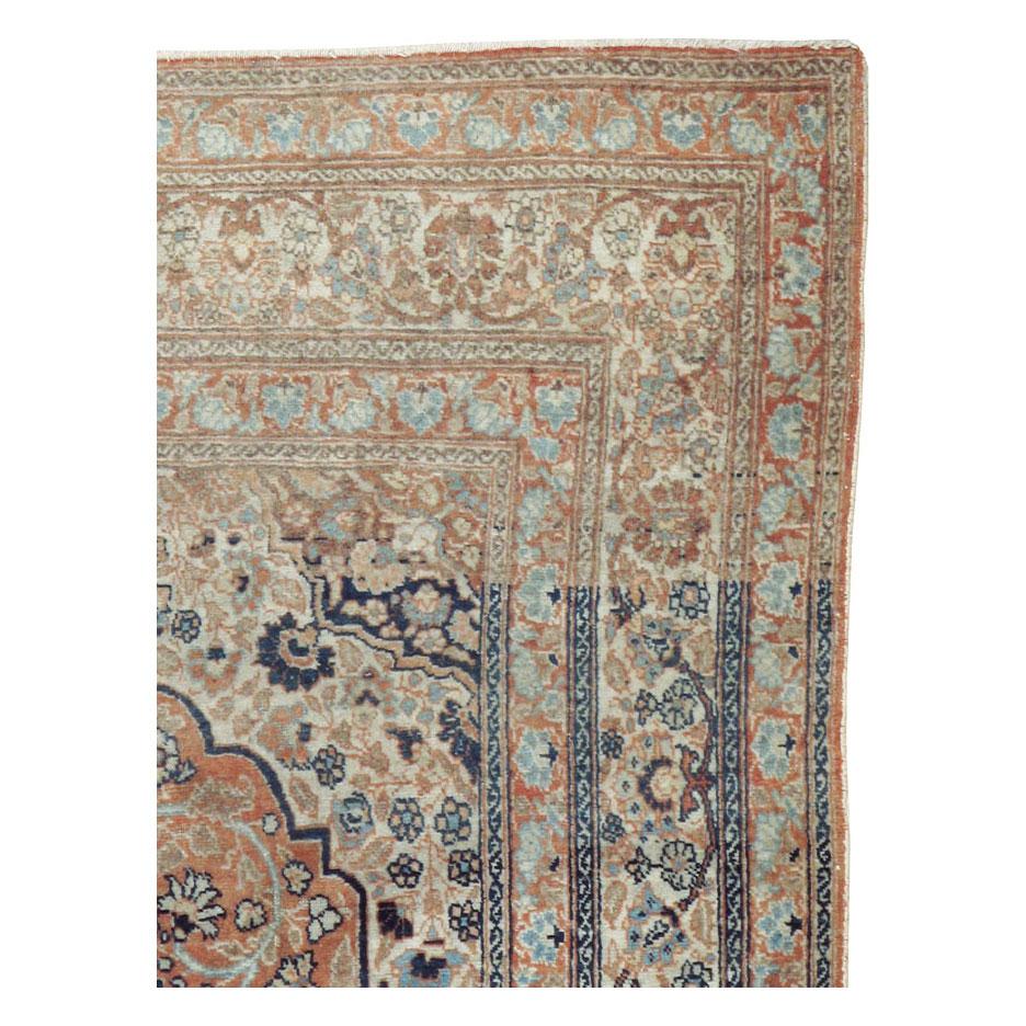 An antique Persian Tabriz accent rug handmade during the early 20th century by master weaver Haji Jalili.

Measures: 4' 1