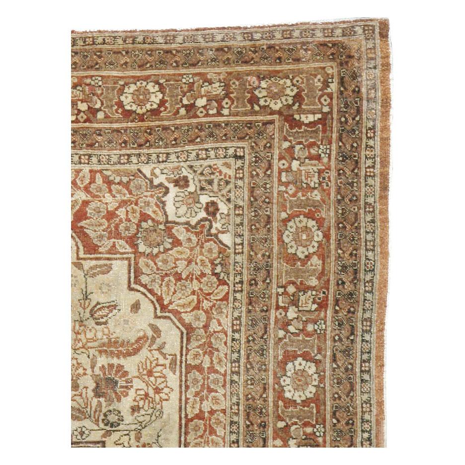 An antique Persian Tabriz Haji Jalili accent rug handmade during the early 20th century.

Measures: 4' 0