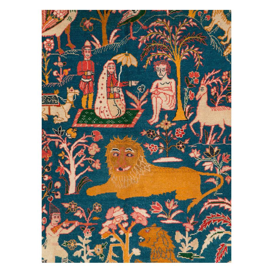 An antique Persian Tabriz pictorial accent rug handmade during the early 20th century.

Measures: 4' 6