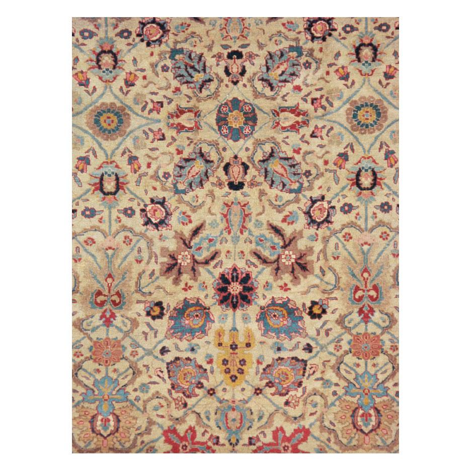 An antique Persian Tabriz small room size carpet handmade during the early 20th century in jewel tones.

Measures: 7' 10