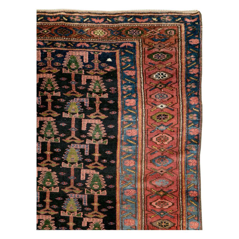 Rustic Early 20th Century Handmade Persian Tribal Gallery Accent Rug in Jewel Tones For Sale