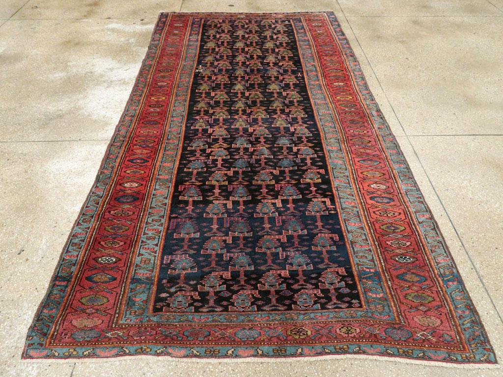 Hand-Knotted Early 20th Century Handmade Persian Tribal Gallery Accent Rug in Jewel Tones For Sale