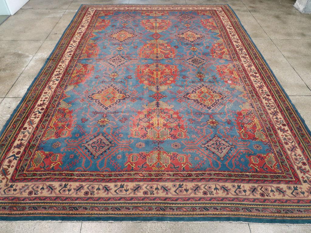An antique Turkish Oushak large carpet handmade during the early 20th century.

Measures: 12' 3