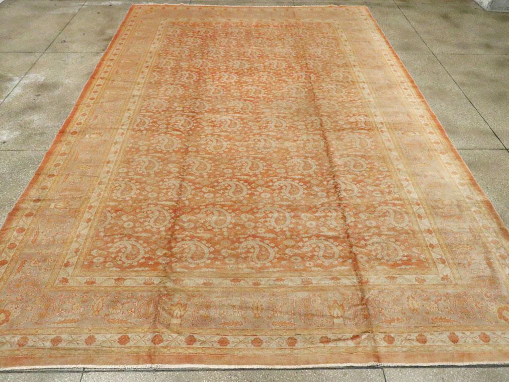 An antique Turkish Oushak large room size carpet handmade during the early 20th century.

Measures: 10' 8