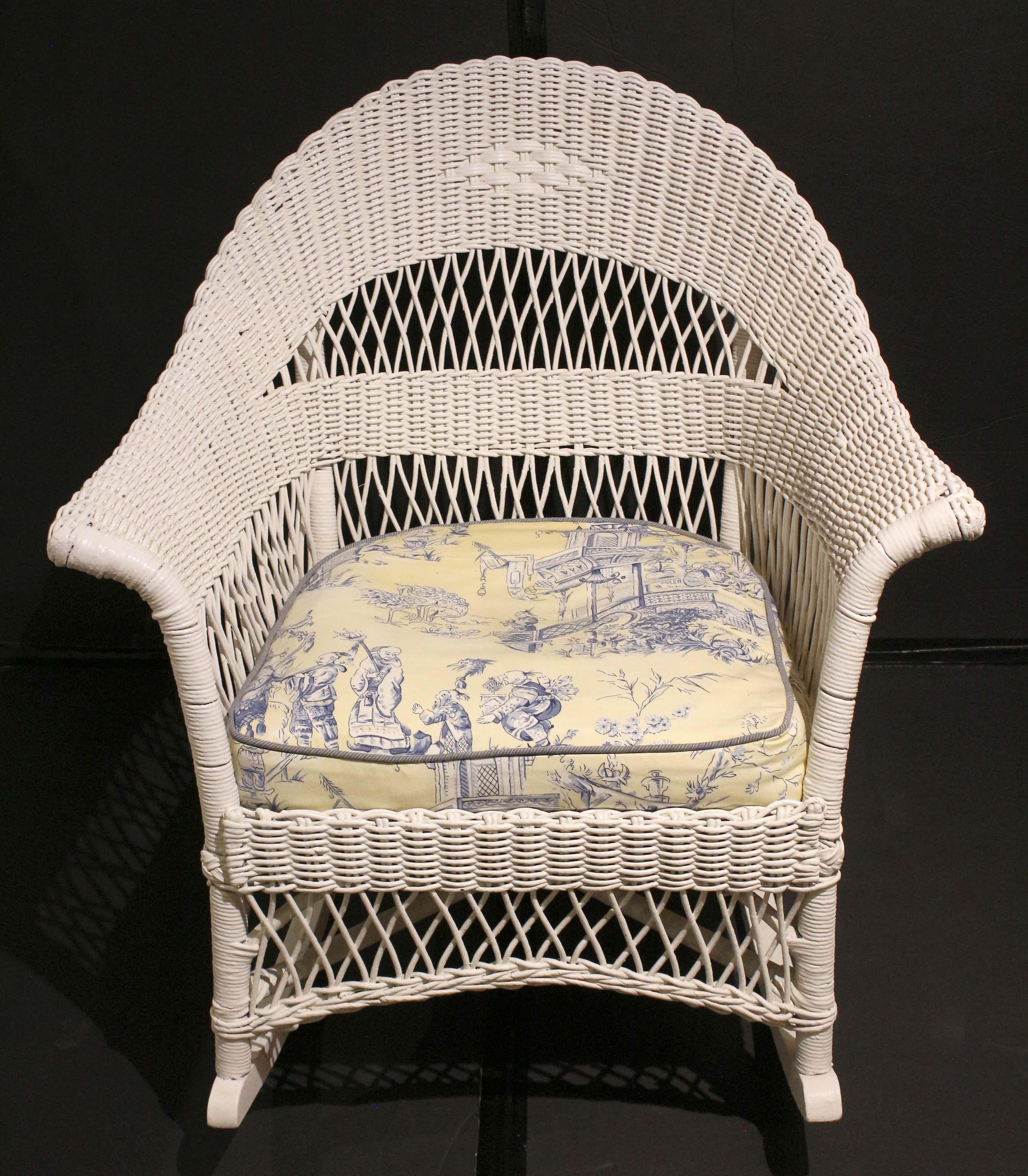 Early 20th century Heywood-Wakefield rocking chair. Close woven wicker in very fine repainted condition with custom toile cushion (used condition). Diamond reed design in the back. Wrapped arms.
30