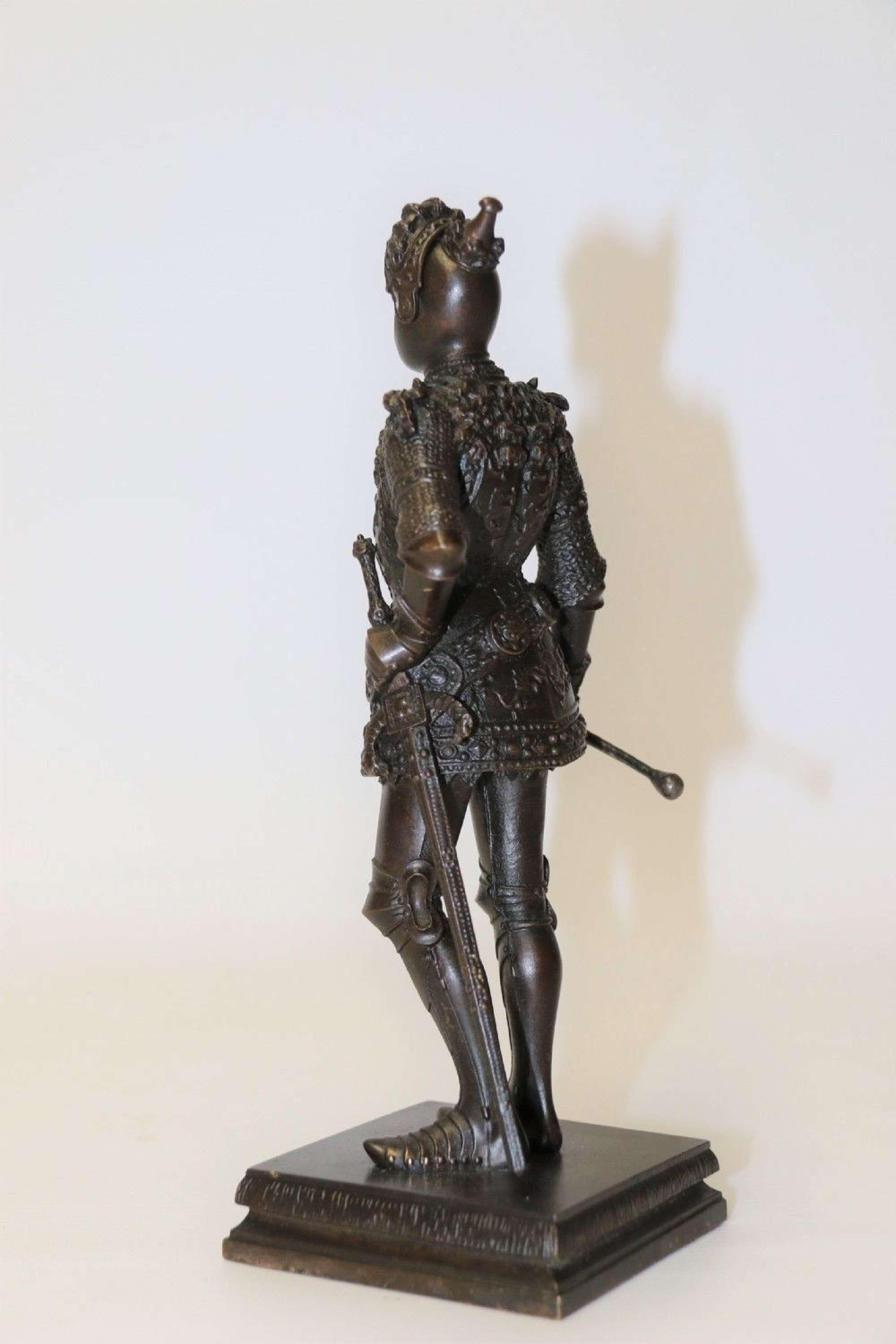 A highly detailed bronze study of King Arthur in ornate armour.

This superbly sculpted bronze study of the English King Arthur dressed for battle in very elaborate armour is entitled to the front Arturkonic V England. He is standing with one hand