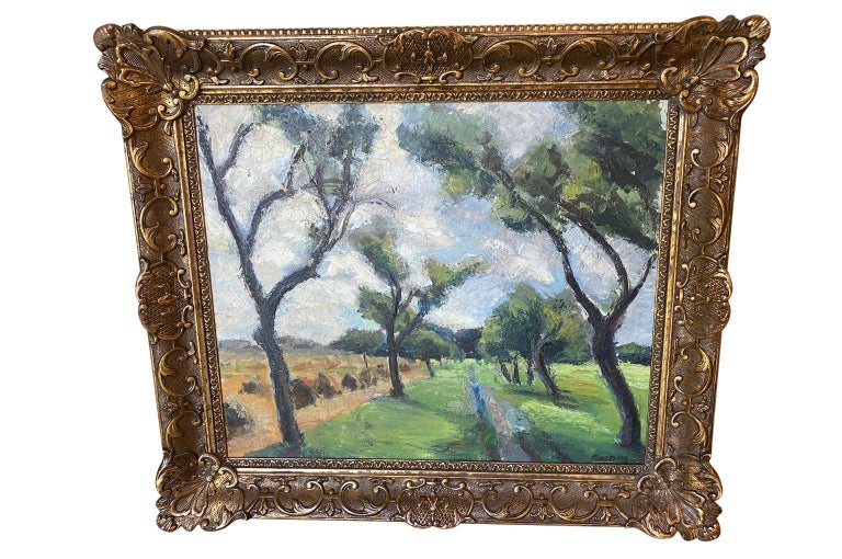 A stunning early 20th century oil on canvas landscape painting of a scene in Aix En Provence housed in a beautiful gold gilt frame. Wonderful color and brushwork.