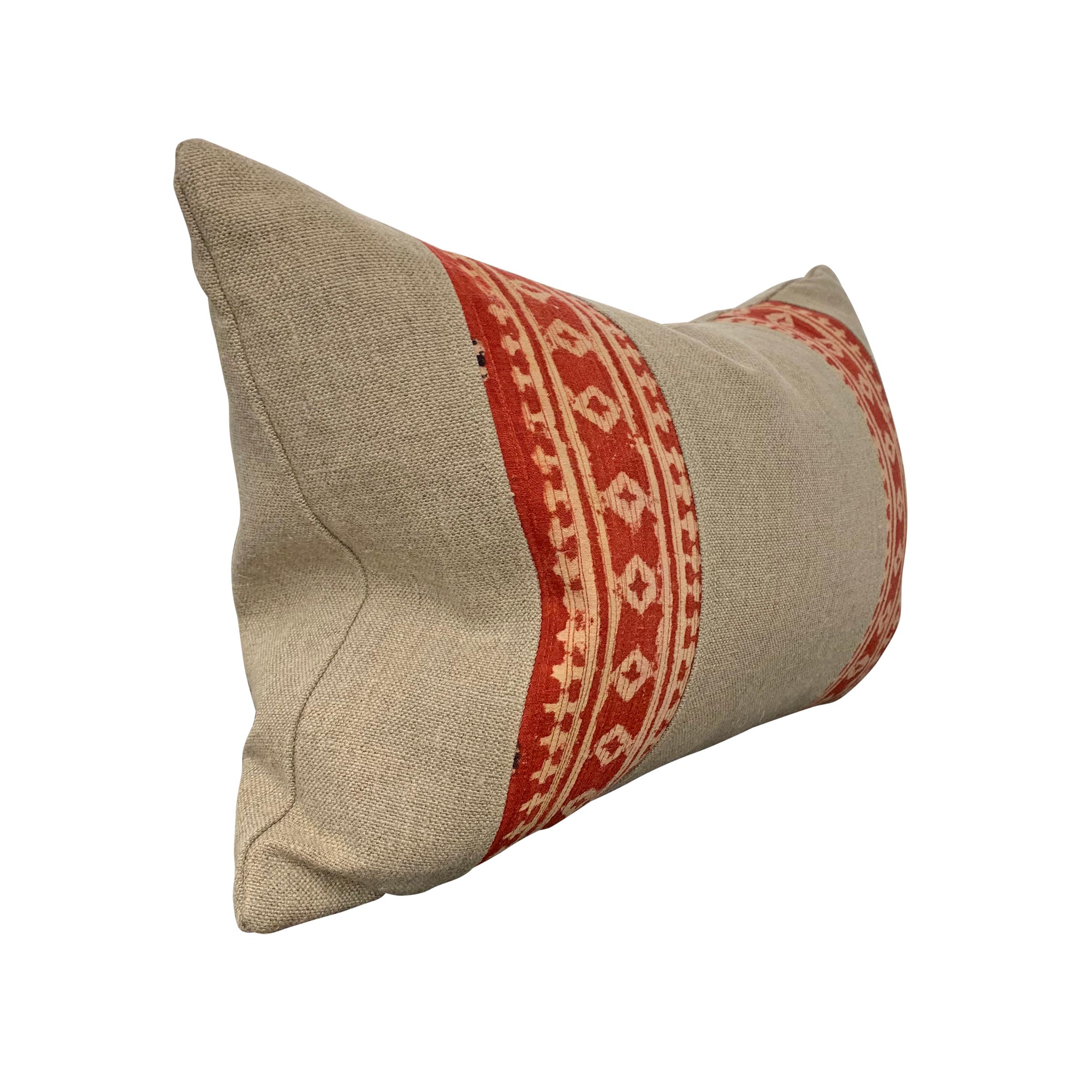 A charming pillow made from two early 20th century Indian block printed panels with repeated diamond patterns, mounted on handwoven Belgian linen, and filled with down.