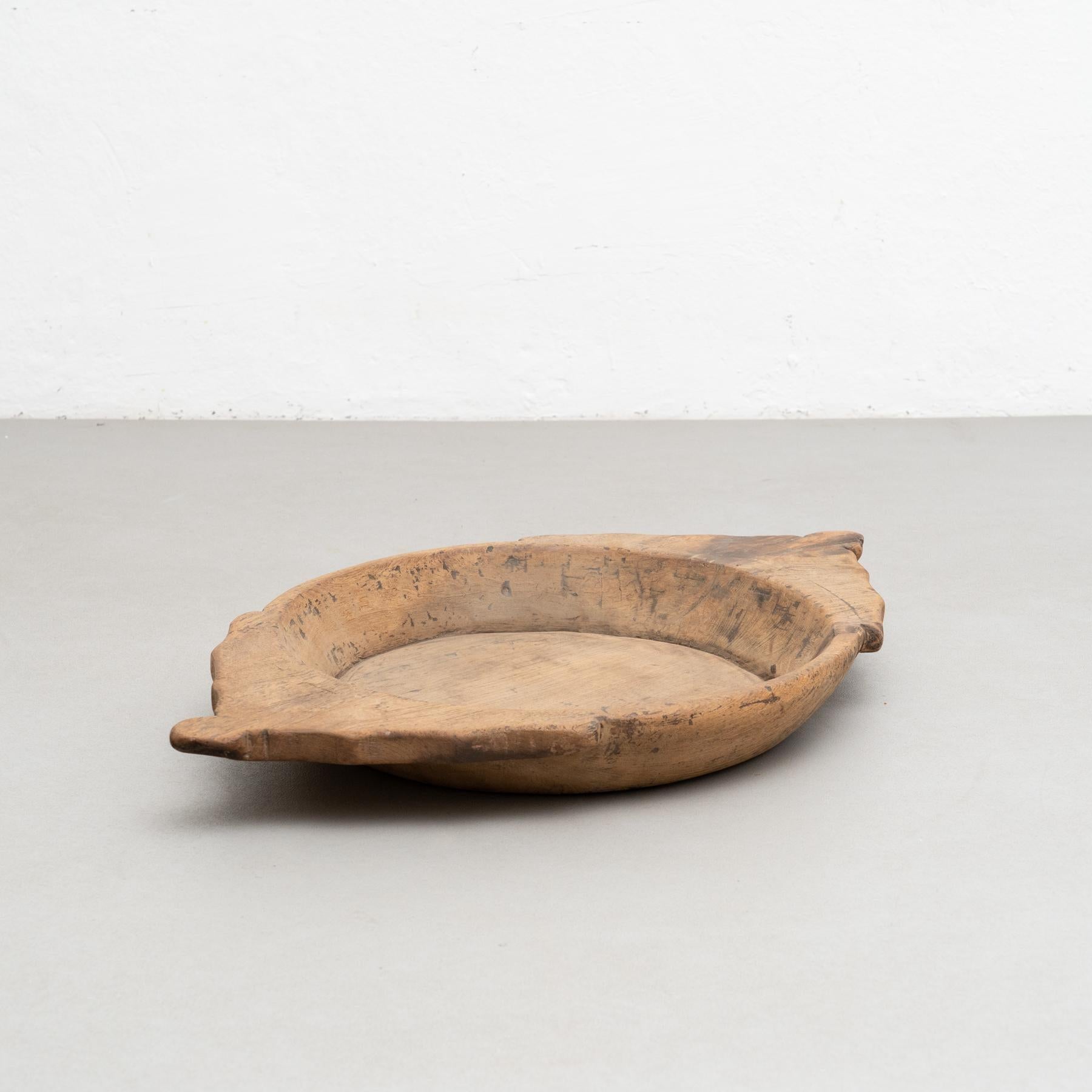 Traditional hand-made wooden plate.    Made by unknown manufacturer in Spain, circa 20th century.    In original condition, with minor wear consistent with age and use, preserving a beautiful patina.    Material:  Wood.   