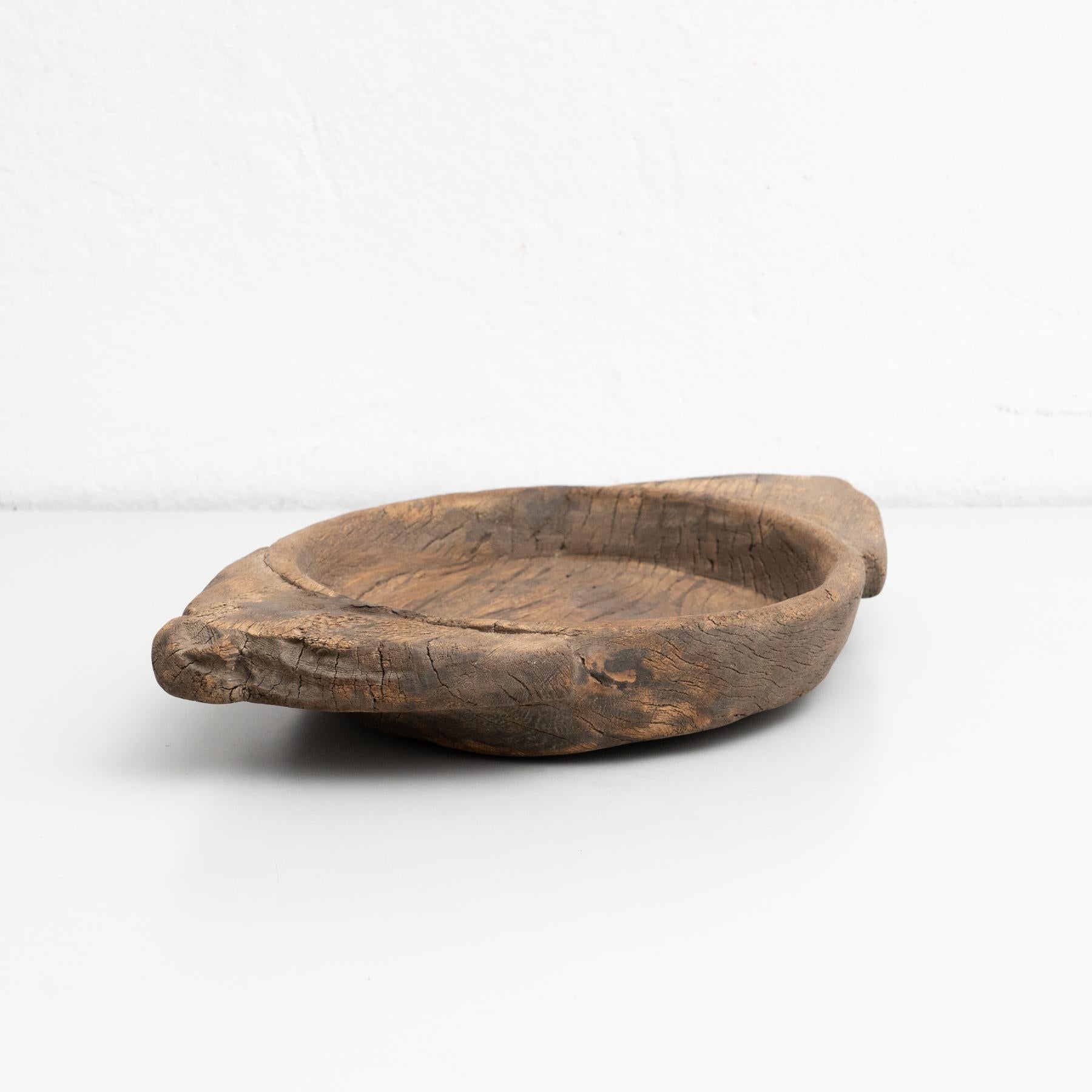 Traditional asian style hand-made wooden plate.    Made by unknown manufacturer in India, circa 20th century.    In original condition, with minor wear consistent with age and use, preserving a beautiful patina.    Material:  Wood.   