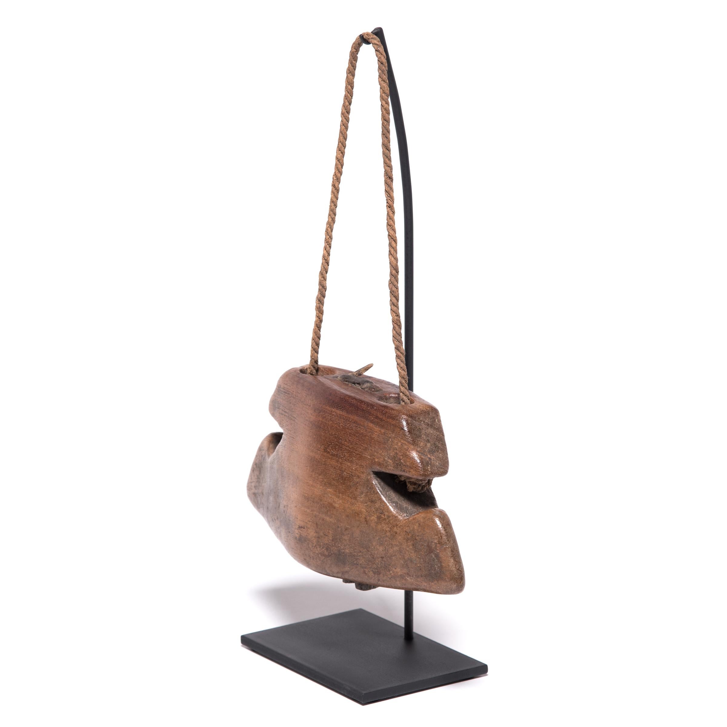 Necklaced on cows or used as percussive instruments in a traditional gamelan, cowbells are still a familiar sight in remote villages of Indonesia. Carved from a single piece of wood, this bell was crafted in Lombok, an island near Bali that is