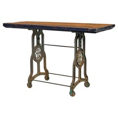 Used Early 20th century industrial cast iron and pine work table