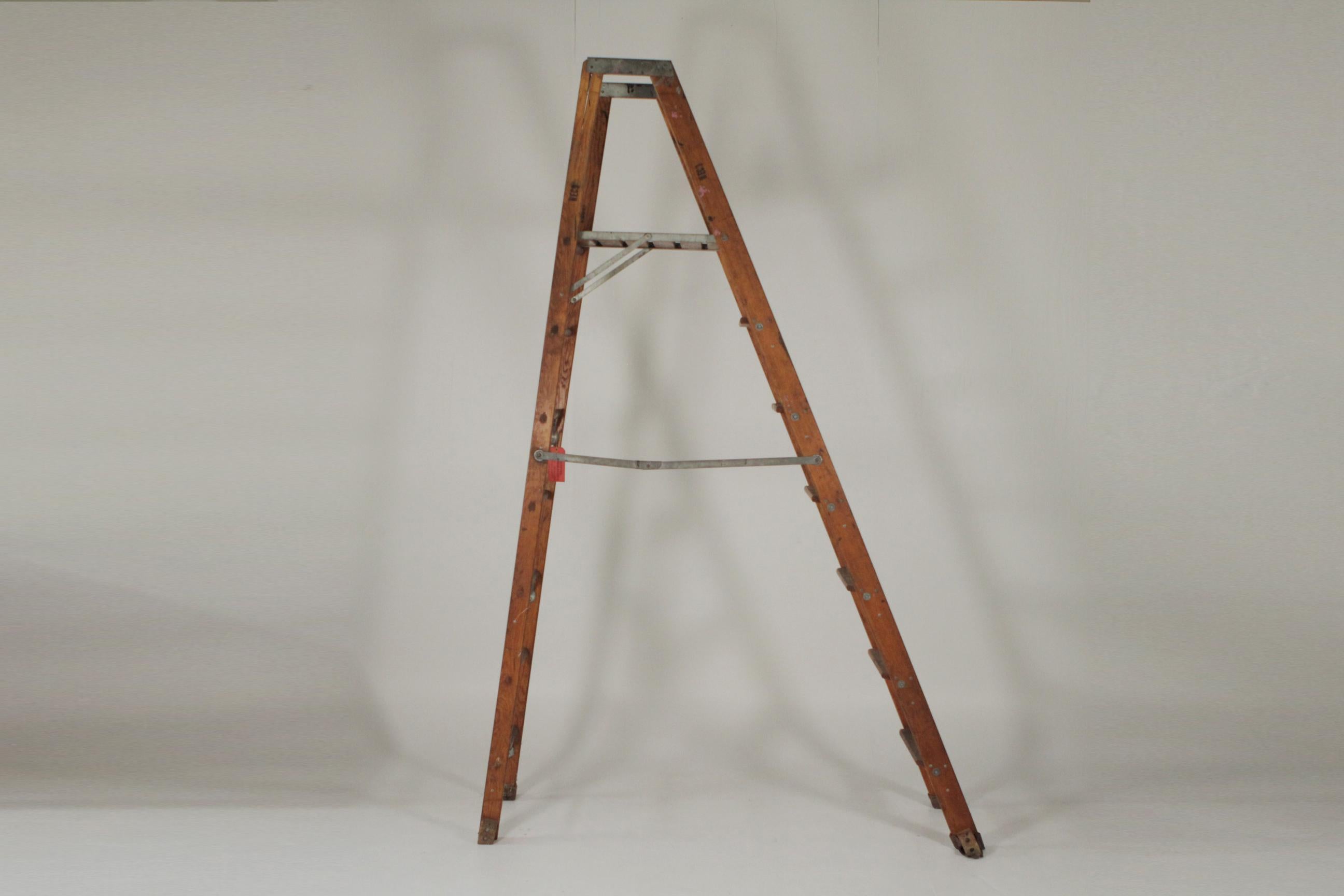 Early 20th century industrial folding ladder, one missing side support, great as a prop or display
99