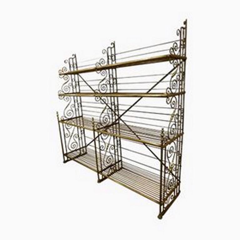 This wonderful Industrial Shelf was located in a French Bakery.
The structure and shelves are made of Iron but the horizontal bars and knobs are made of brass. An elegant, fine design, typical of this period.
Shelves and laterals disassemble quickly
