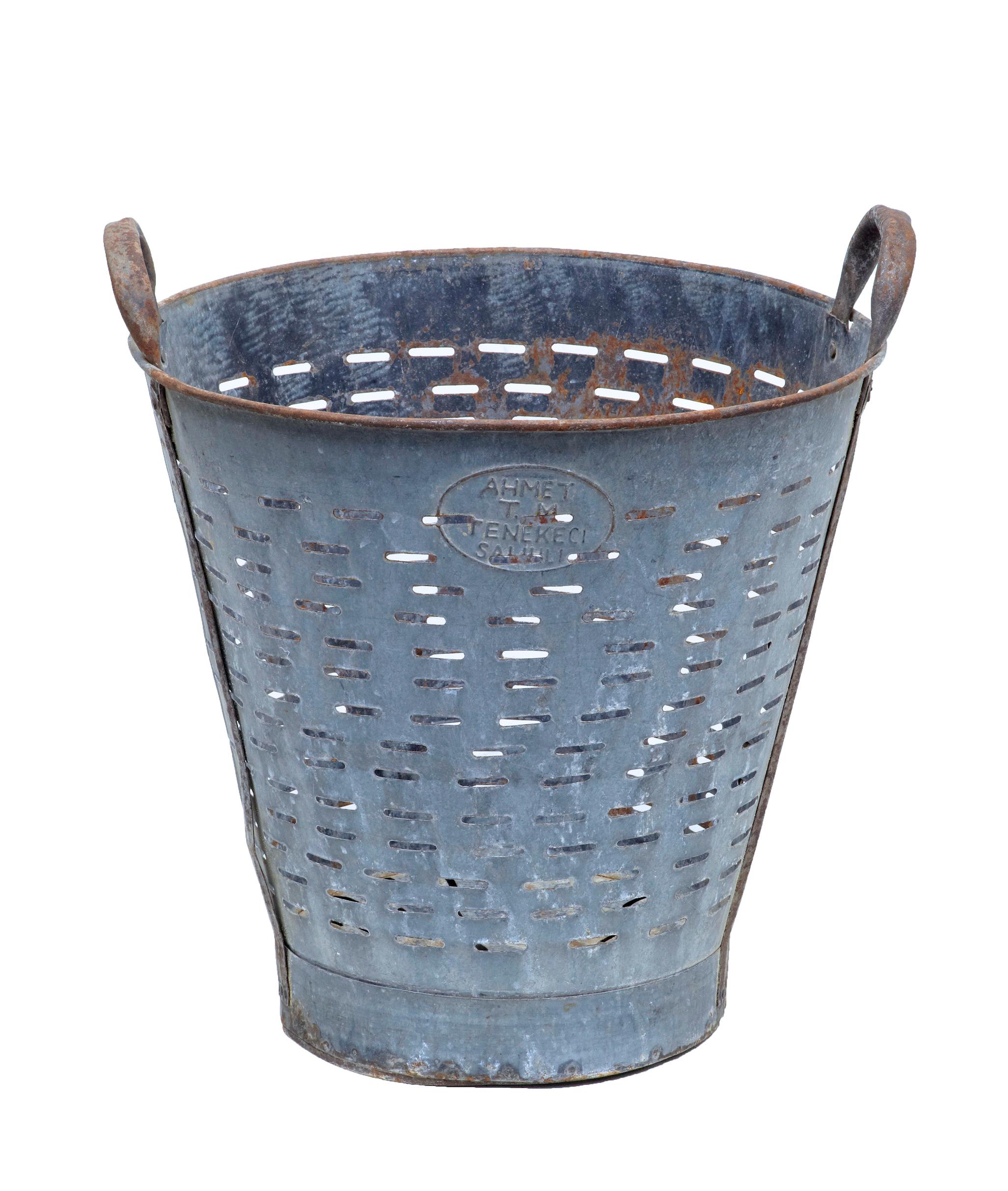 Early 20th century industrial metal basket, circa 1920.

Scandinavian fishing basket, with slotted sides and 2 carrying handles. Ideal for re-use as a waste paper basket or log bin.

Has taken on a desirable patina with mild rusting.