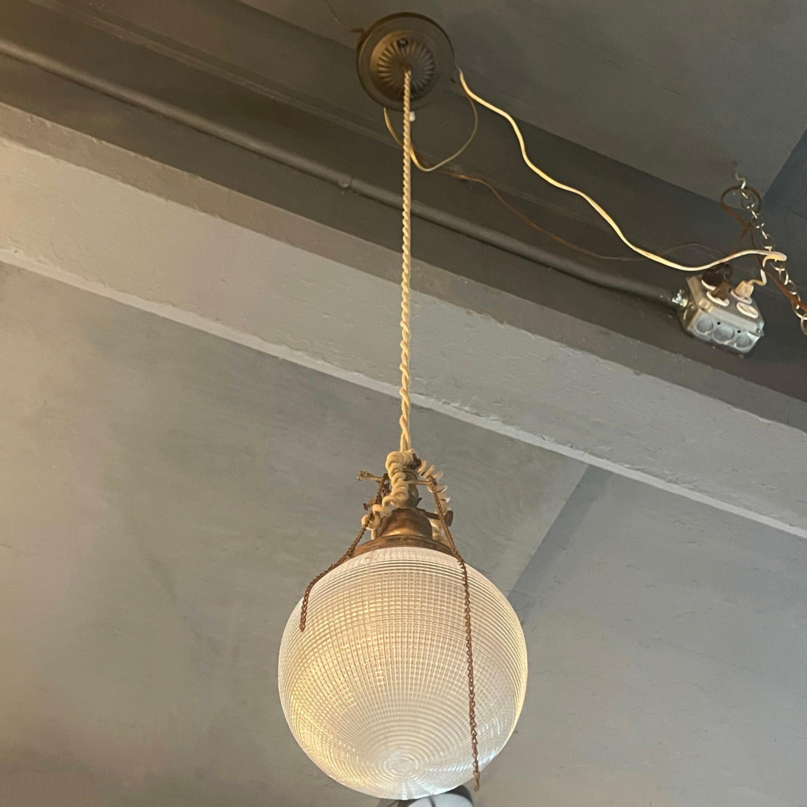 Early 20th Century Industrial Prismatic Holophane Glass Globe Pendant In Good Condition For Sale In Brooklyn, NY